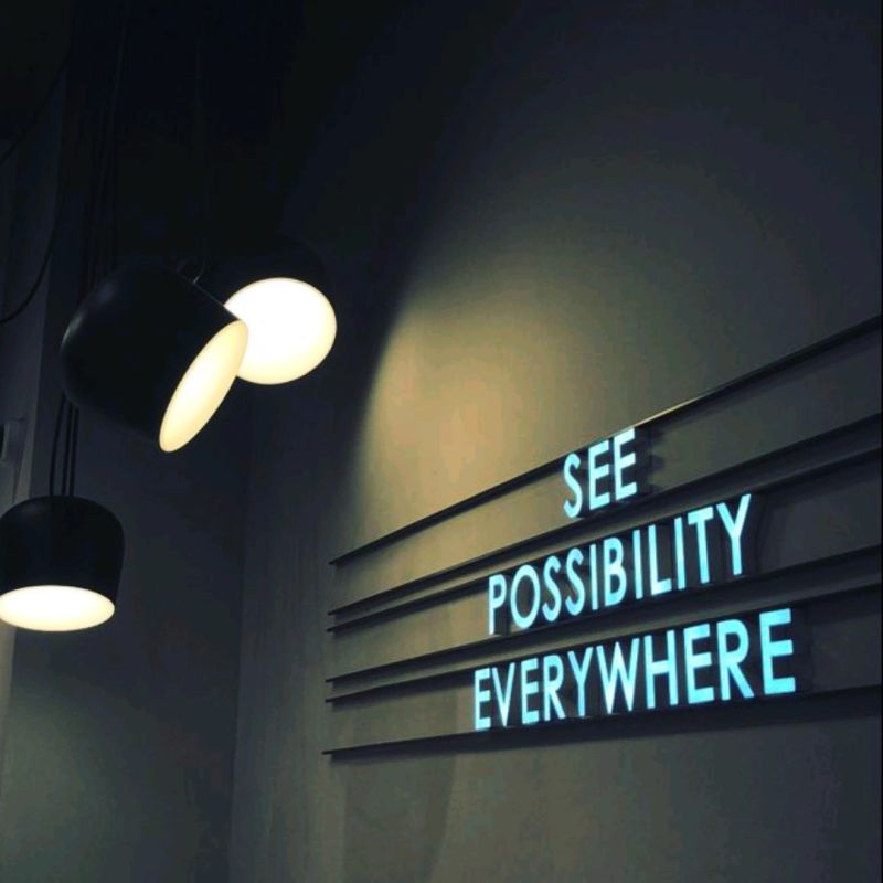 Words on a wall that say “See Possibility Everywhere.”